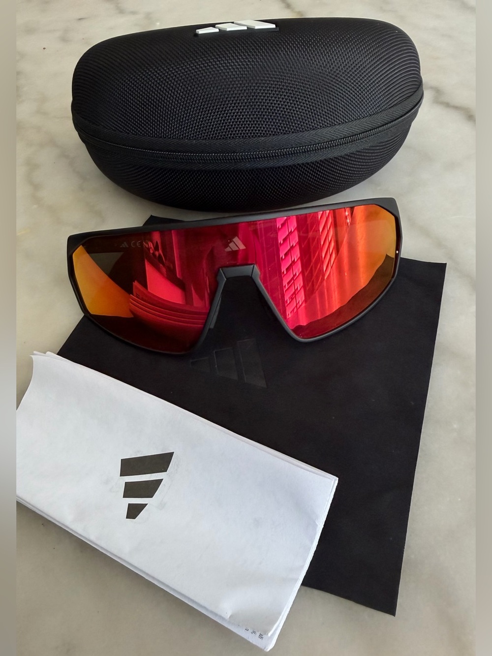 adidas Black Frame Sunglasses with Red-Orange Mirrored Lens